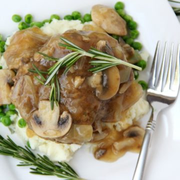Easy Salisbury Steak with Mushroom Gravy - This homemade salisbury steak incorporates mushrooms and onions right into the beef patties!