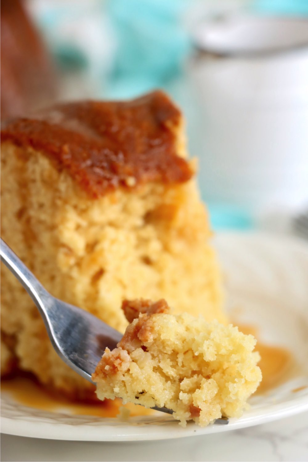 a fork holding a piece of kentucky butter cake