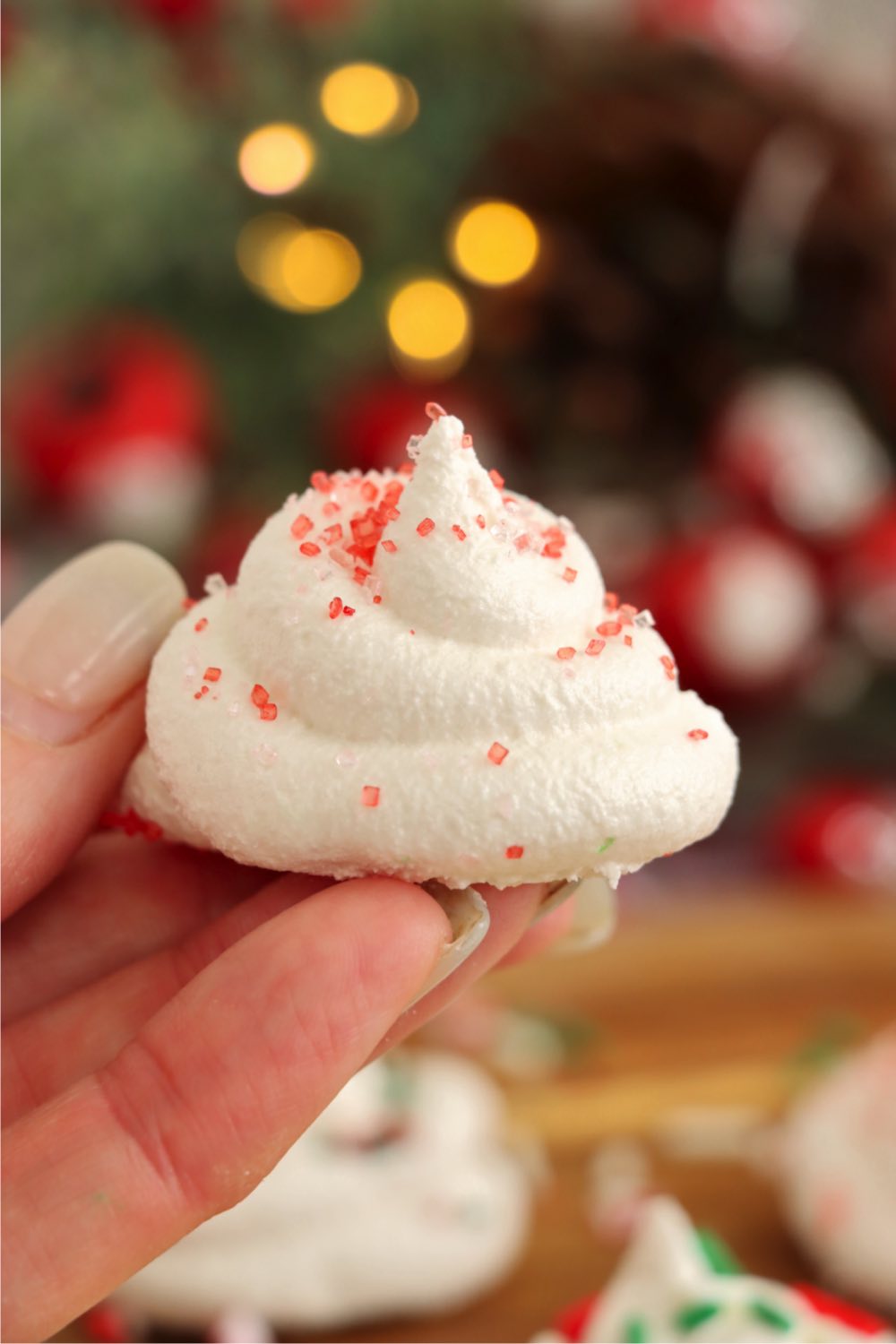 hand holding a piece of divinity candy