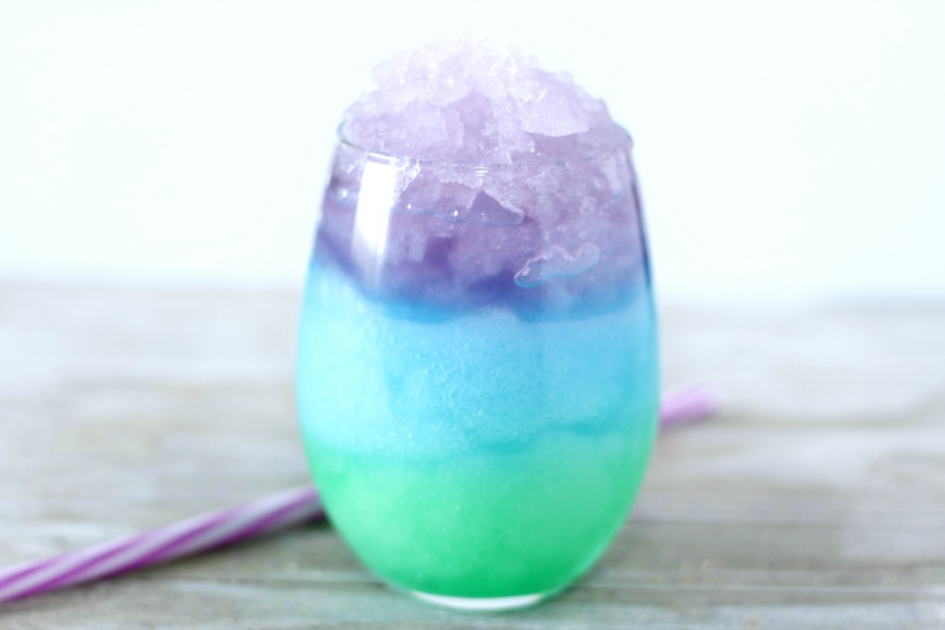 Mermaid Slush - A fun and colorful kid-friendly layered drink perfect for birthdays and parties! #slush #kidsdrink #slushie #BitznGiggles #mermaid #recipe #drinkrecipes #drinks #nonalcoholicdrinks #slushies