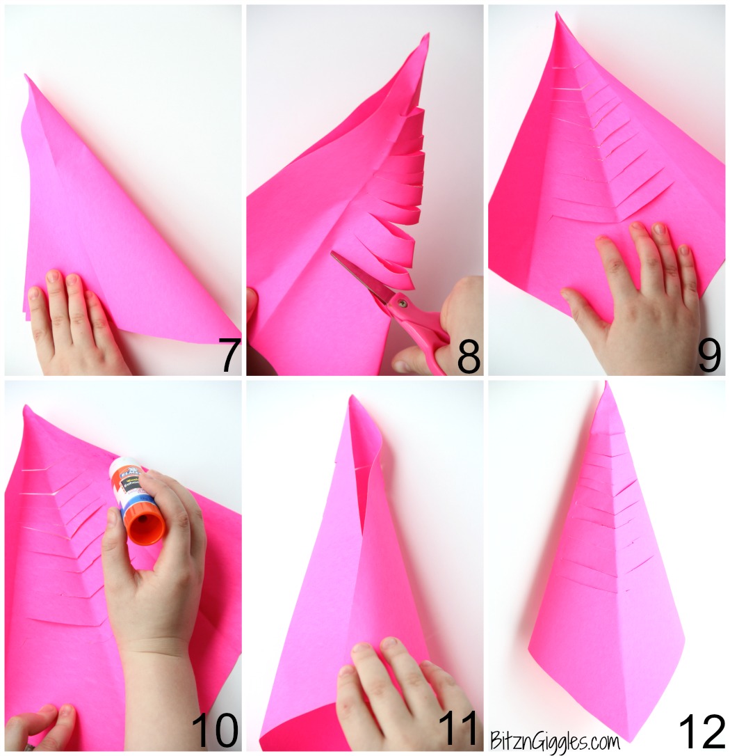 Slinky Fish Craft - All you need is construction paper, scissors and glue stick for this fun and colorful kids craft! The slinky "cut" makes the fish flexible almost like it's swimming!