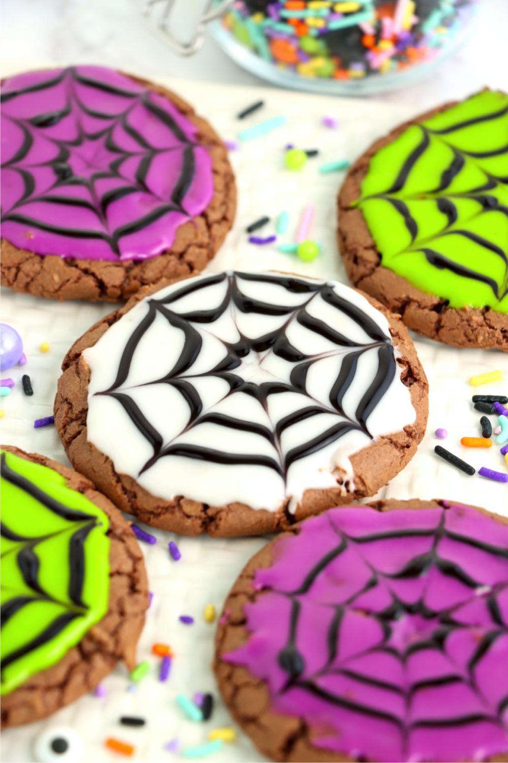 bright cookies decorated with spider webs