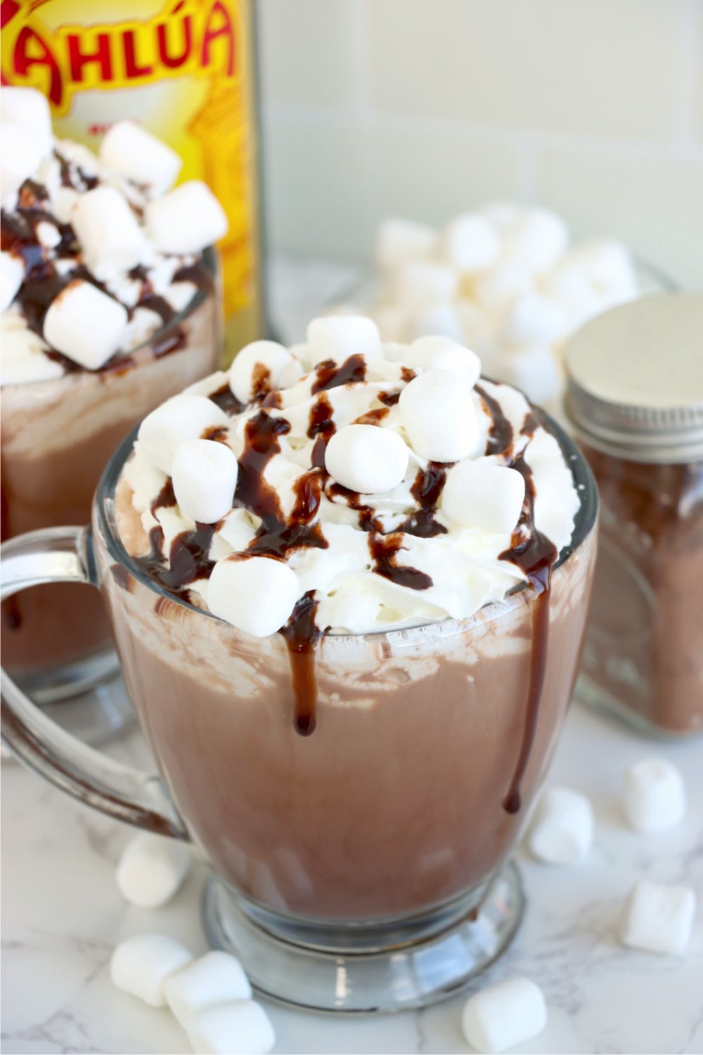 glass mug of cocoa with toppings