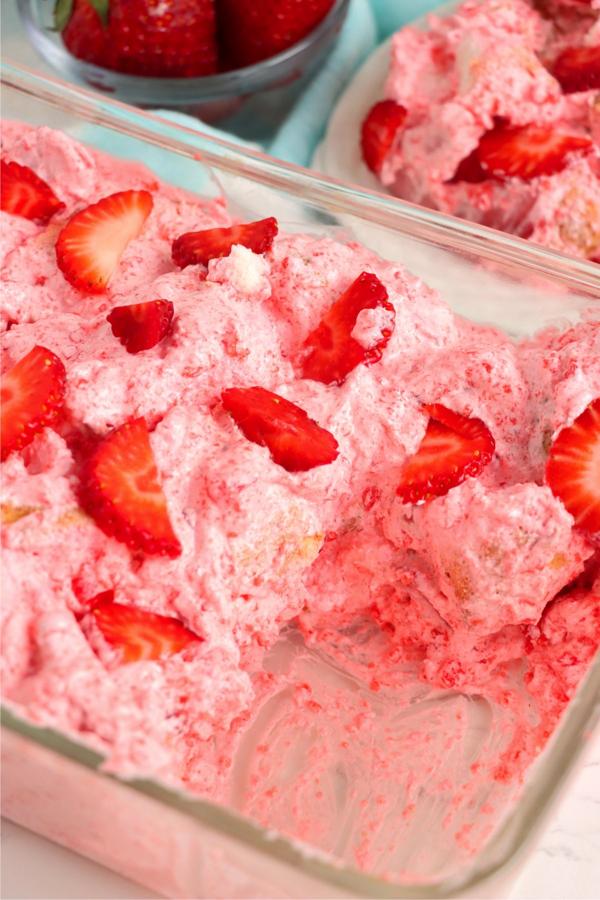 Piece taken out of a strawberry no-bake fluff dessert