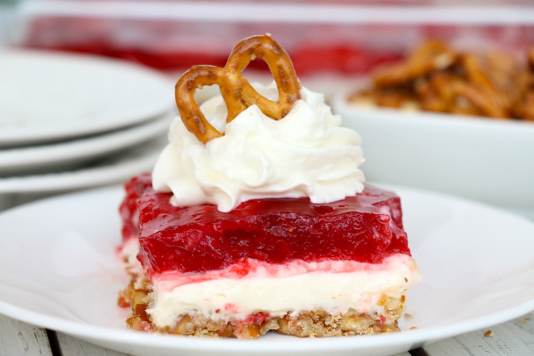 Strawberry Pretzel Dessert - This classic, potluck favorite features a crunchy pretzel crust topped with sweet cream and an irresistible strawberry jello topping. It's the perfect combination of sweet and salty!