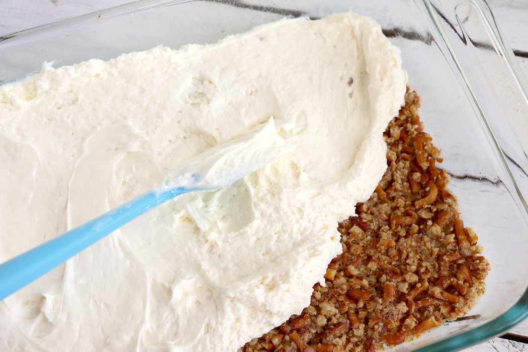 Strawberry Pretzel Dessert - This classic, potluck favorite features a crunchy pretzel crust topped with sweet cream and an irresistible strawberry jello topping. It's the perfect combination of sweet and salty!