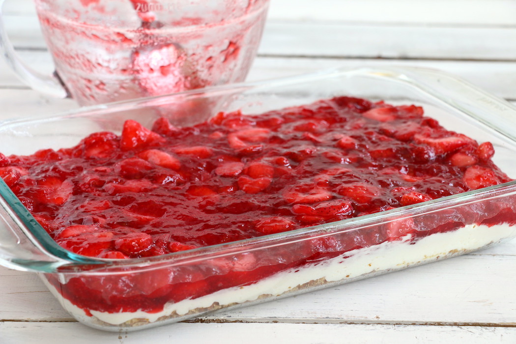 Strawberry Pretzel Dessert - This classic, potluck favorite features a crunchy pretzel crust topped with sweet cream and an irresistible strawberry jello topping. It's the perfect combination of sweet and salty!
