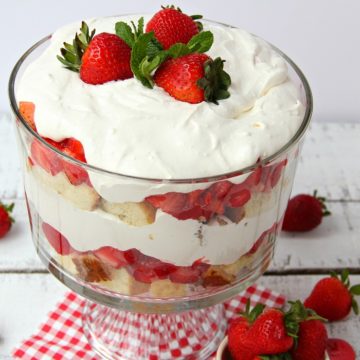 Strawberry Shortcake Trifle - A beautiful and delicious trifle layered with vanilla cake, homemade strawberry glaze and cream! Such a pretty dessert!