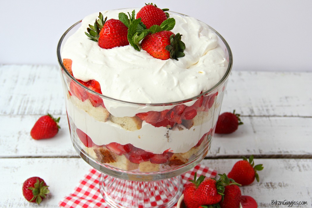 Strawberry Shortcake Trifle - A beautiful and delicious trifle layered with vanilla cake, homemade strawberry glaze and cream! Such a pretty dessert!