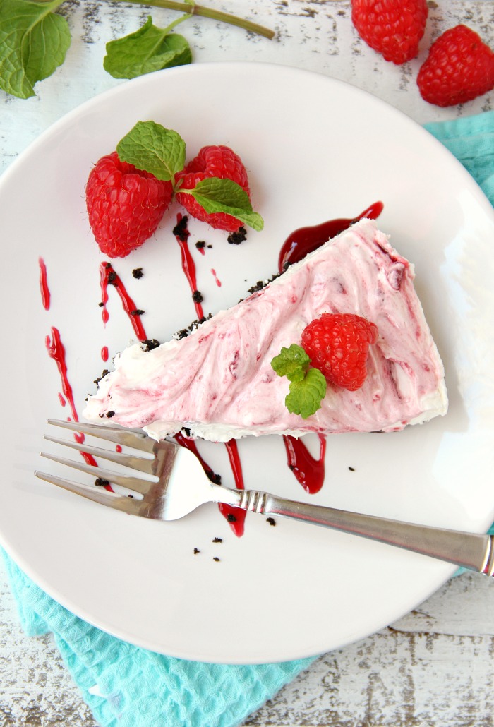 Swirled Raspberry Cheesecake -A fluffy Oreo-crust cheesecake with decadent raspberry swirls.