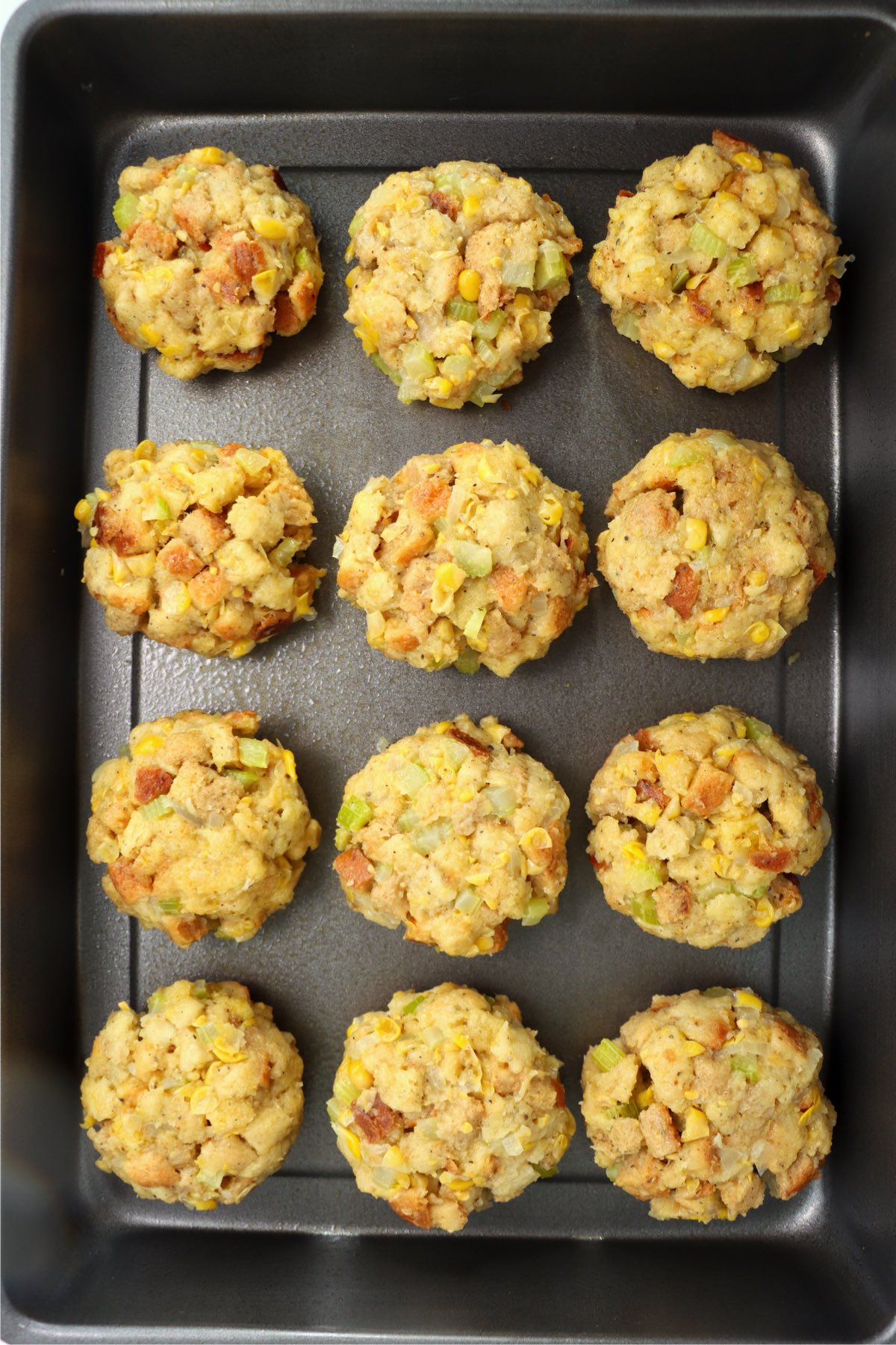 baking sheet filled with balls of Thanksgiving stuffing