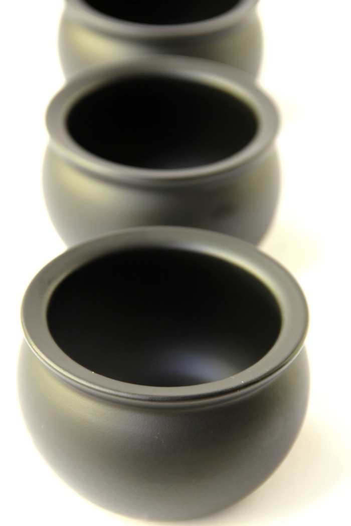 Witch Cauldron Mug Cake - A chocolate mug cake made in a ceramic witch cauldron with halloween-themed frosting and sprinkles!