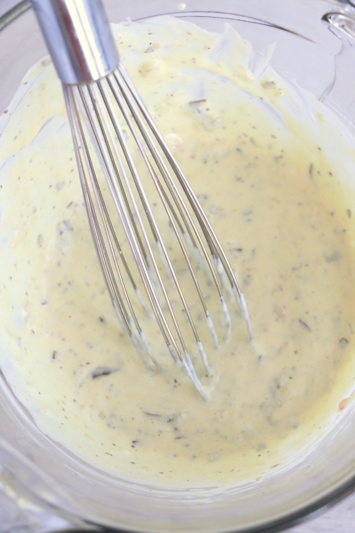 whisking pasta salad dressing
