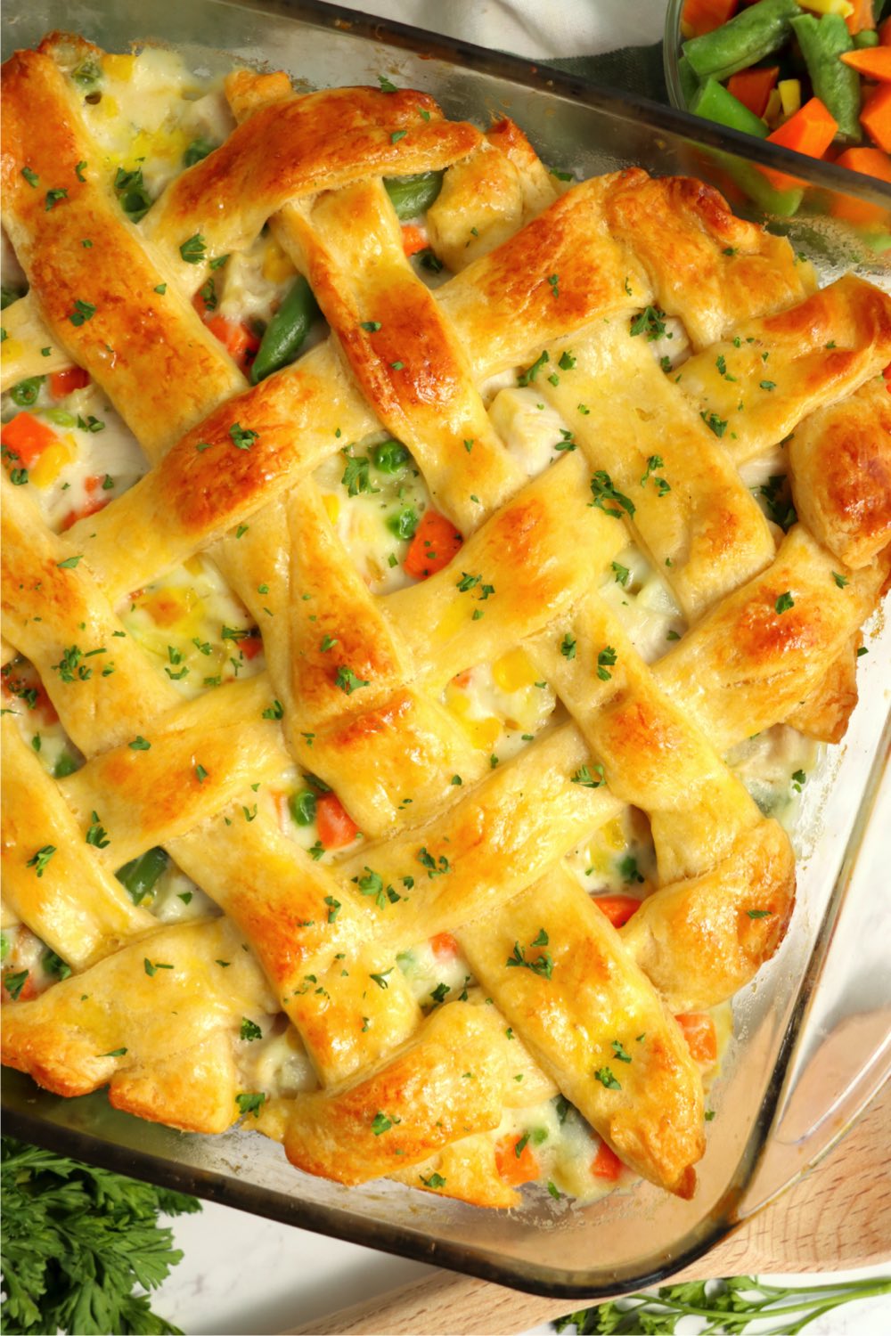 pan with casserole covered with crescent roll lattice crust