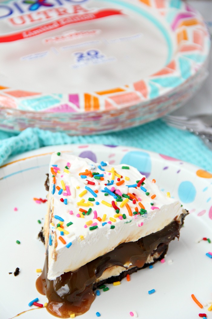Ultimate Ice Cream Sundae Pie - Fudge and caramel topping filled ice cream pie with a fluffy whipped topping covered in sprinkles!