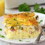 Ultimate Oven Omelette - This omelette is filled with veggies, ham and cheese and baked in the oven. Perfect for a party crowd!