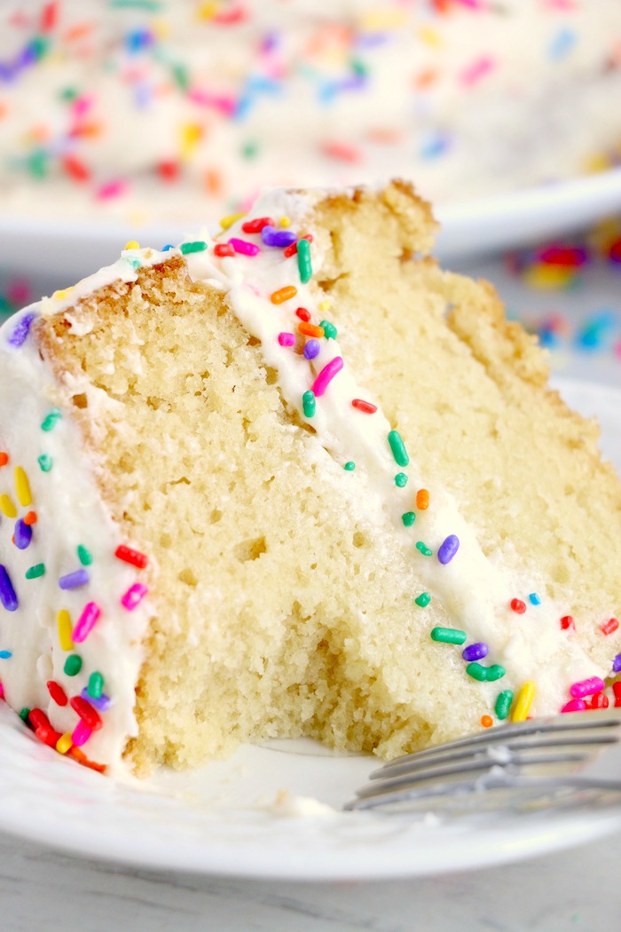 Piece of vanilla crazy cake with bite taken out