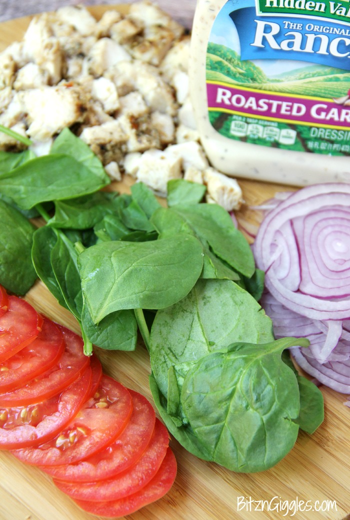 Chicken Ranch Tortilla Pizza - A quick and delicious "skinny" pizza with sprinkles of grilled chicken and fresh vegetables, bursting with mouth-watering garlic and ranch flavors!