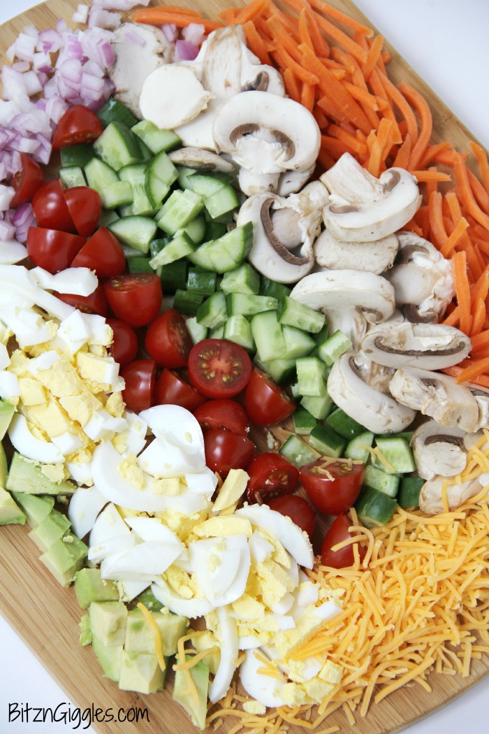 A delicious, crisp chopped salad with loads of fresh veggies, perfect for serving up in the summer after a visit to the farmer's market!