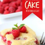 Warm Raspberry Cake with Vanilla Glaze - just like your mom used to make! A delicious cake with fresh raspberries baked in and topped with a sweet vanilla glaze!
