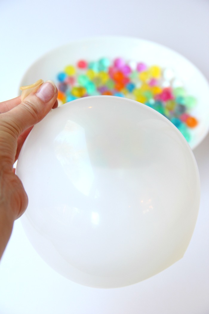 Water Bead Stress Ball - A transparent balloon filled with colorful water beads makes for a soothing and fun kids toy or stress reliever!