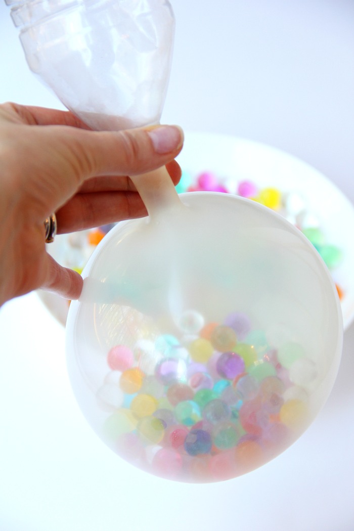 Water Bead Stress Ball - A transparent balloon filled with colorful water beads makes for a soothing and fun kids toy or stress reliever!