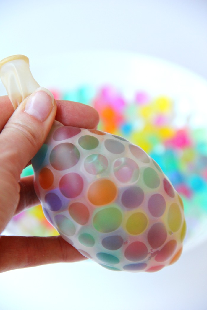 Water Bead Stress Ball - A transparent balloon filled with colorful water beads makes for a soothing and fun kids toy or stress reliever!