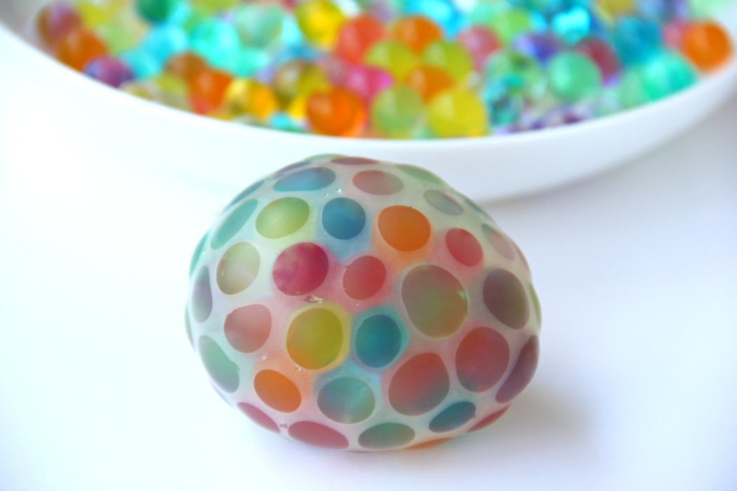 Water Bead Stress Ball - A transparent balloon filled with colorful water beads makes for a soothing and fun kids toy or stress reliever!