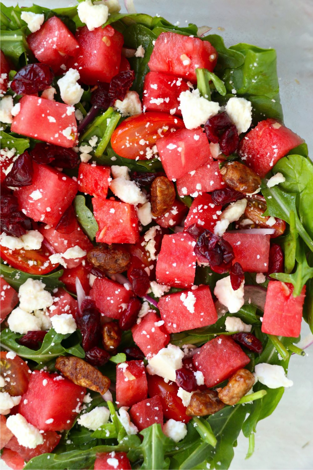 watermelon, feta and greens in a salad