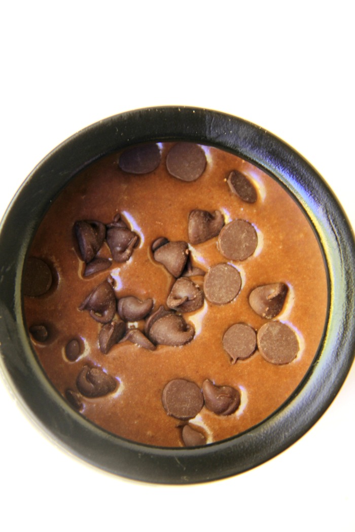 Witch Cauldron Mug Cake - A chocolate mug cake made in a ceramic witch cauldron with halloween-themed frosting and sprinkles!