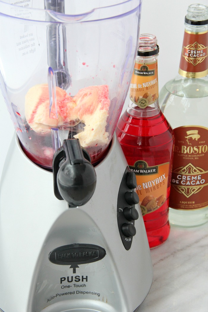 blender filled with ice cream and almond and chocolate liqueur