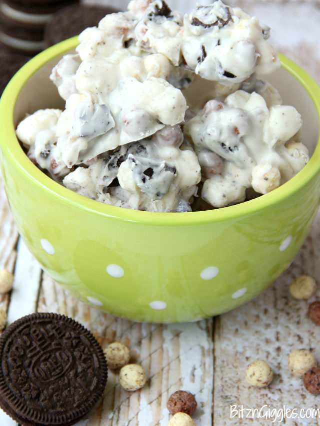 Cookies and Cream Cereal Treats - White chocolate clusters of Oreo pieces, marshmallows and cookies and cream cereal! All you need is a microwave and a couple minutes to whip up these delicious and simple treats!